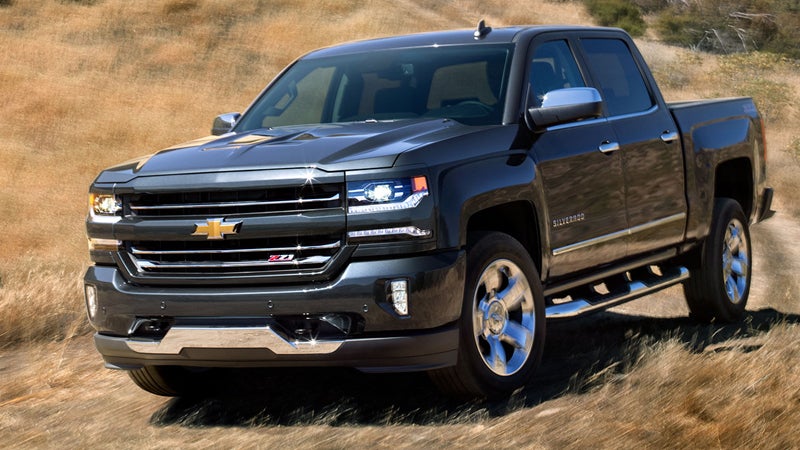 Black Silverado 1500 shining in the dessert grass
