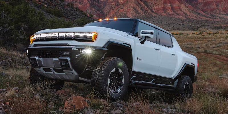 white GMC hummer EV offroading