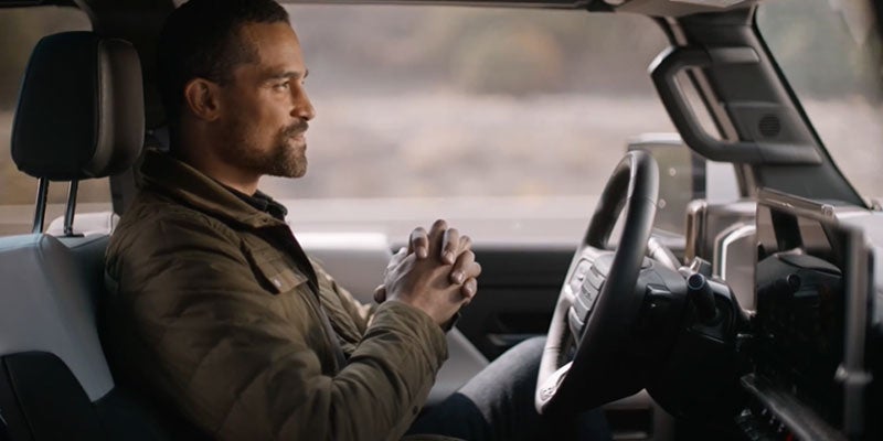 person sitting inside of GMC hummer EV